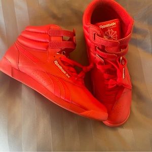 Women’s red classic Reeboks